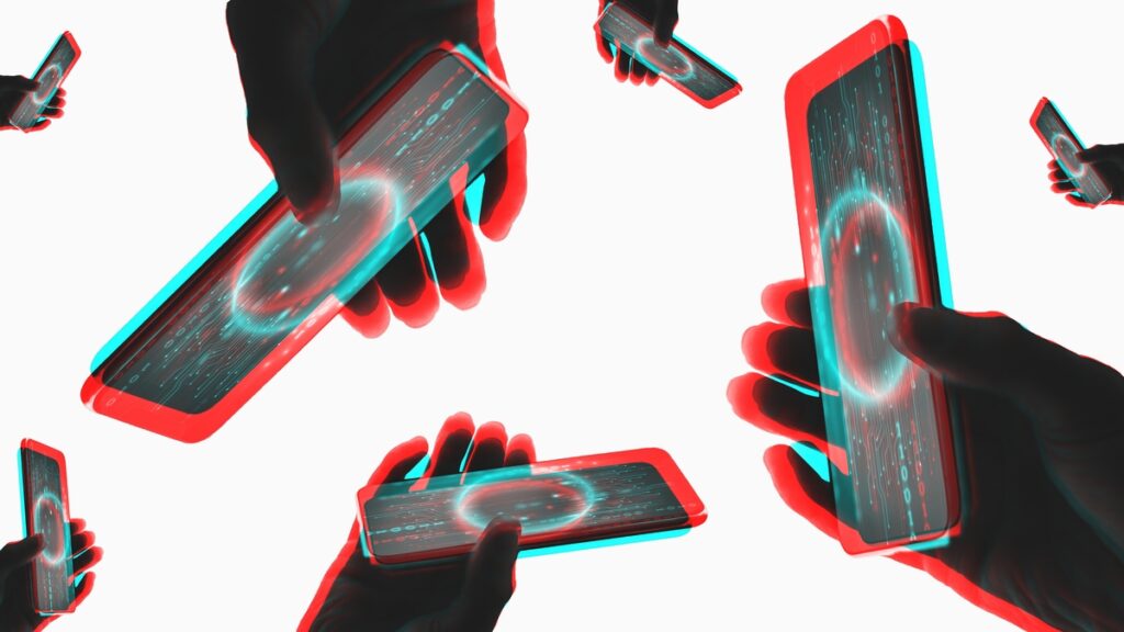 Hænder holder smartphones, hvor skærmene viser cirkler i neonfarver 